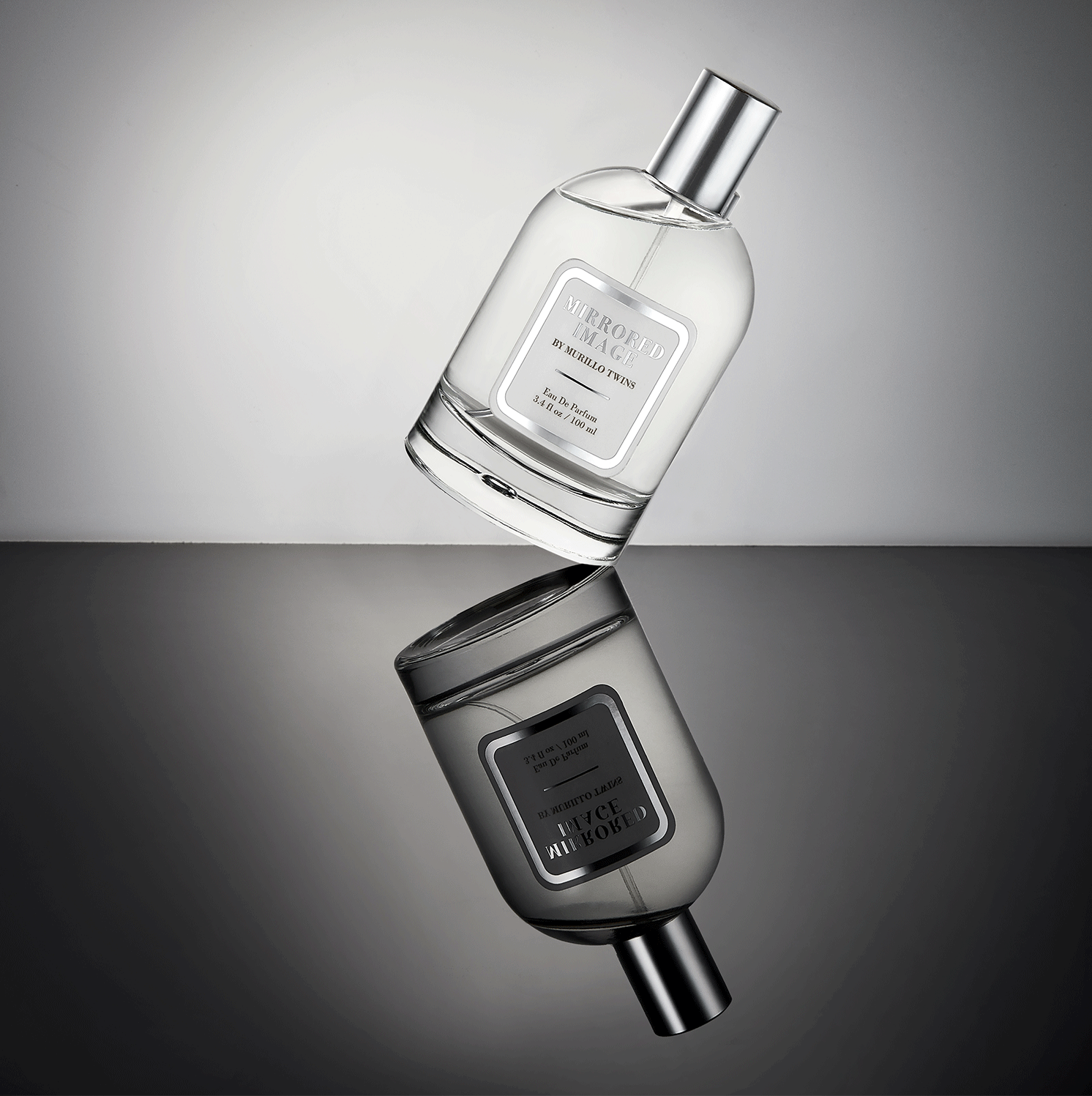 Mirrored Image, the best-selling perfume created by celebrities Brittany and Briana Murillo, tiled on its side.