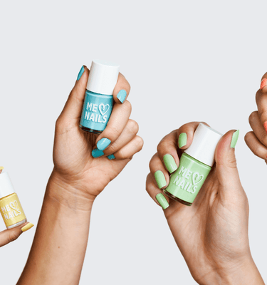 Six hands holding six different bottles of the perfect pastel nail polish colors.