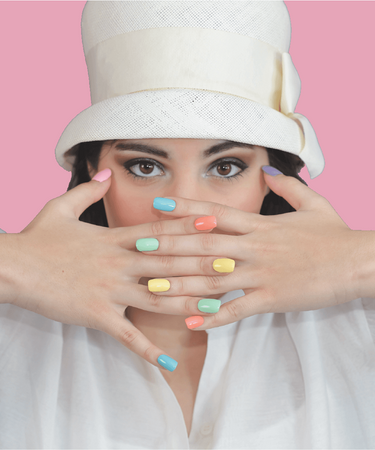 Female influencer, Moriah Elizabeth, showing off her painted nails with her best-selling ME Nails Polish Set.