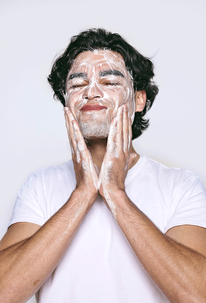 A man applying the best face wash for men. Achieve healthier, glowing skin with easy-to-use skincare essentials.