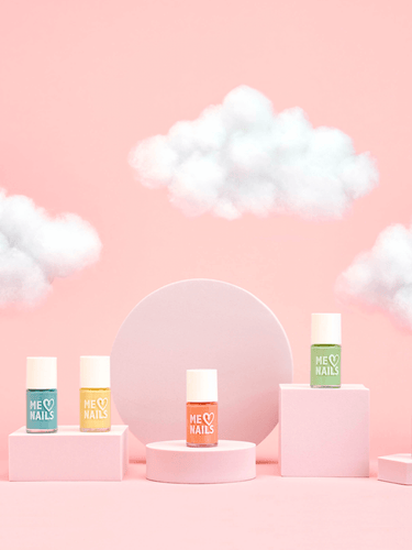 Six of the best pastel nail polishes displayed next to each other on different shaped stands with a pink cloudy background.