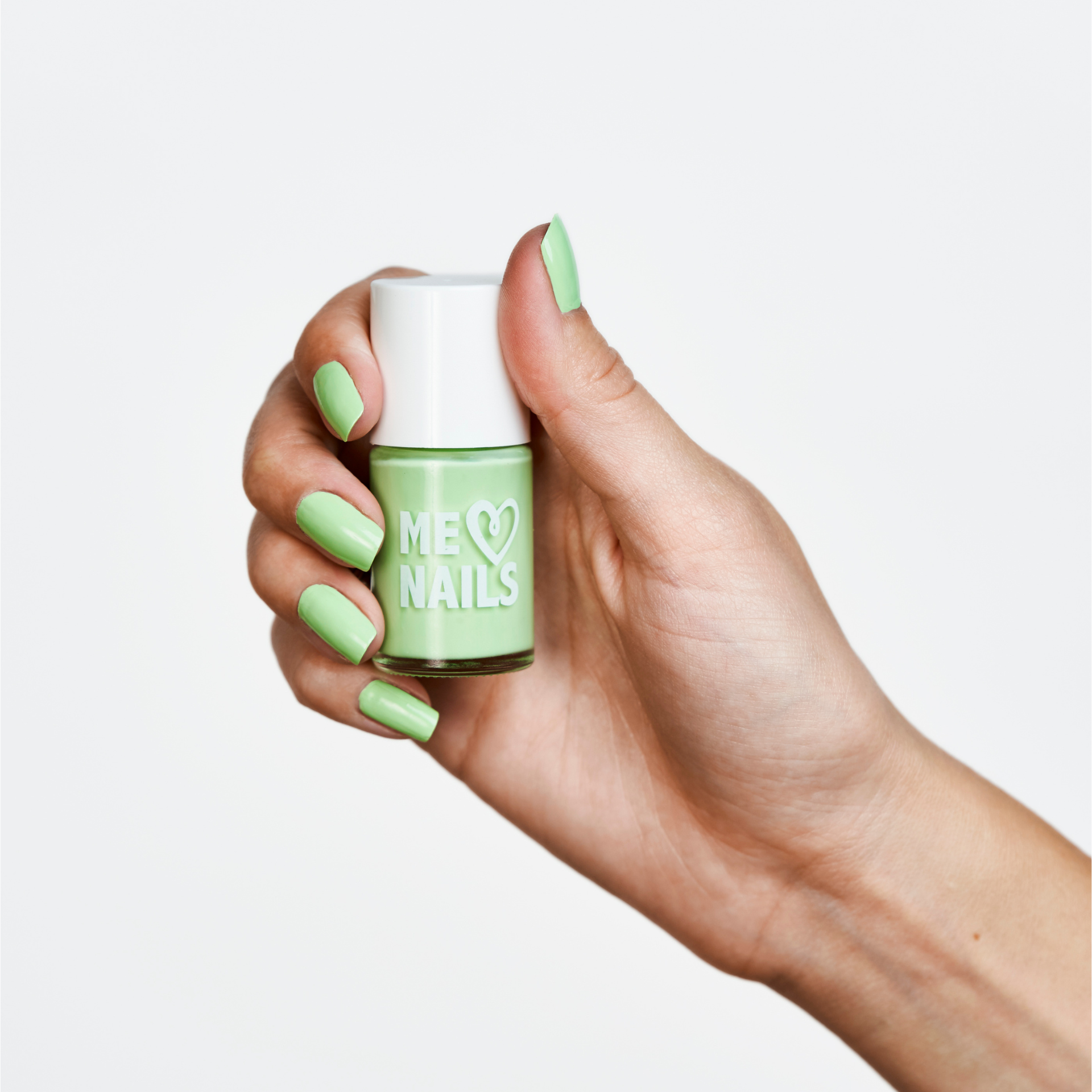 A hand holding YouTube star, Moriah Elizabeth, Key Lime Green nail polish.